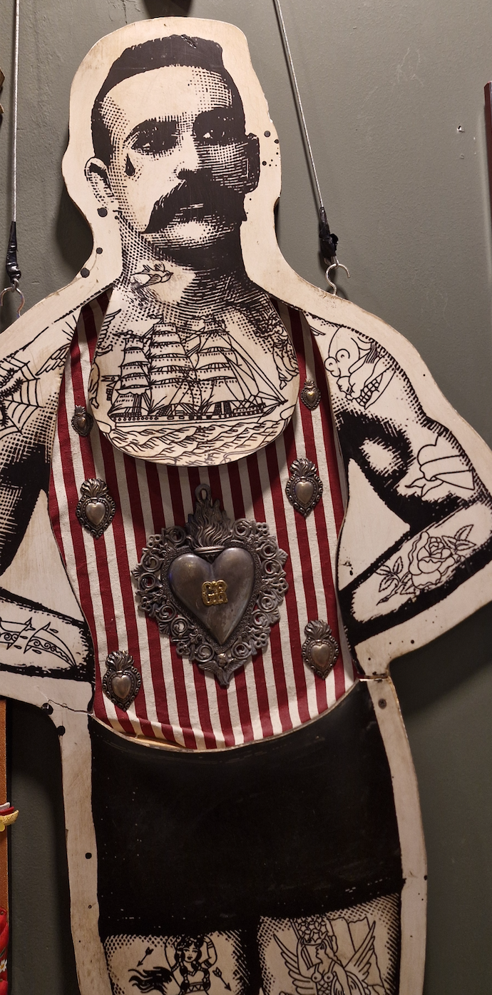 Tattoo-inspired studio artwork representing Zua